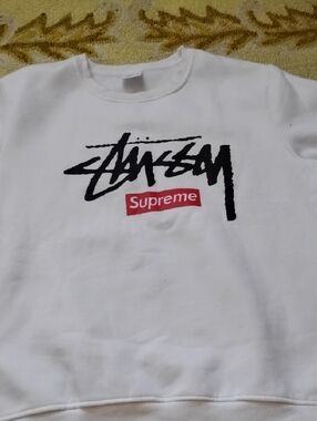 Supreme White Sweatshirt with Black Graphic and Red Logo